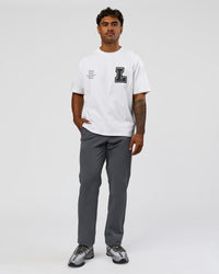 Man wearing Hype Heavyweight Unisex Oversized Tee - Off White-Black | Model:Xavier | Size:L