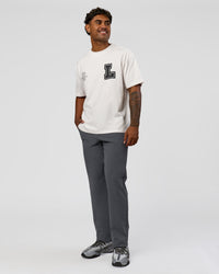 Man wearing Hype Heavyweight Unisex Oversized Tee - Off White-Black | Model:Xavier | Size:L