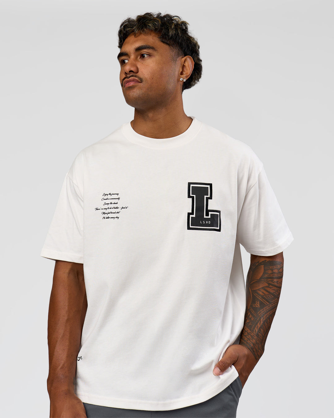 Man wearing Hype Heavyweight Unisex Oversized Tee - Off White-Black | Model:Xavier | Size:L