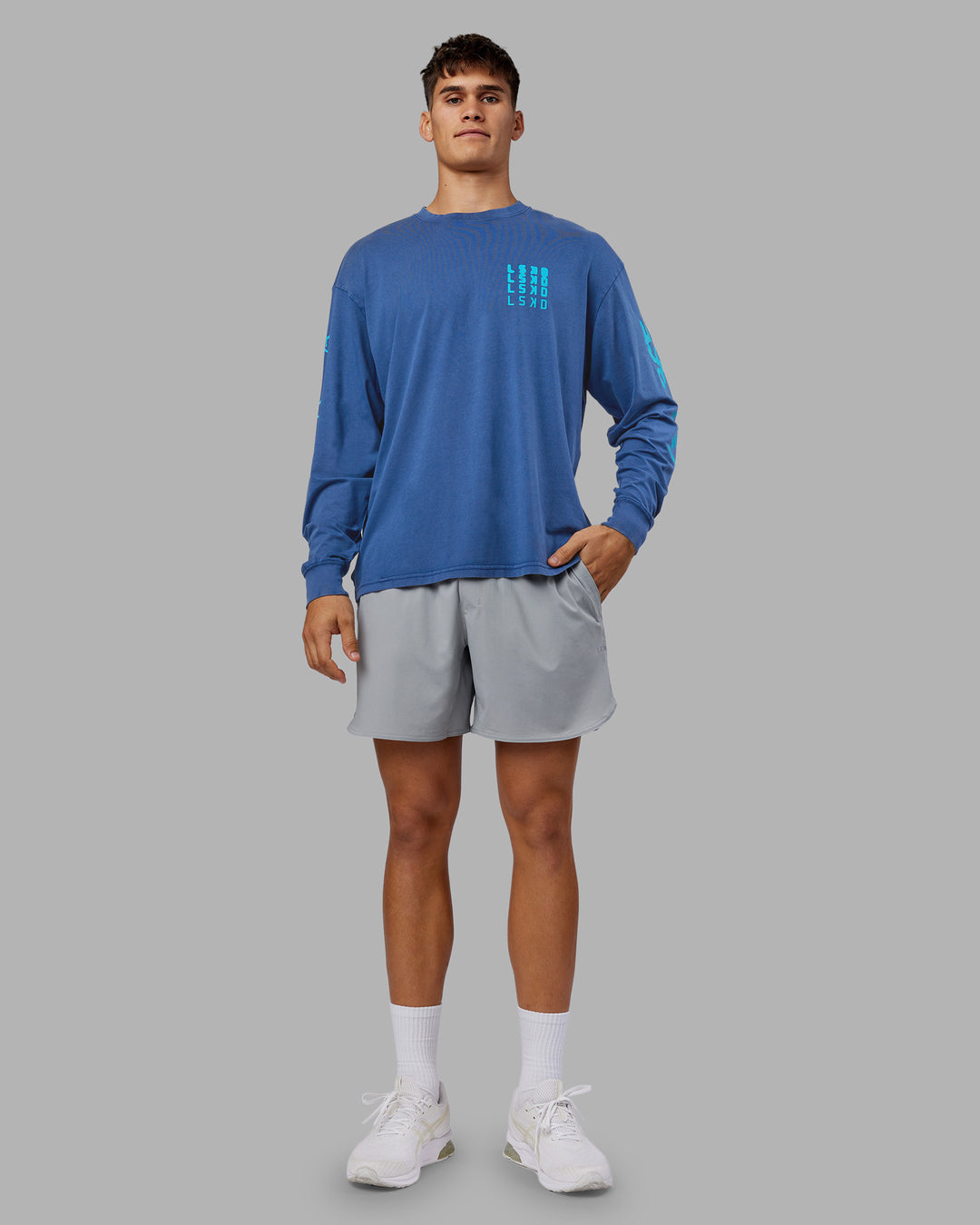 Man wearing Inferno Journey FLXCotton Oversized Long Sleeve Tee - Midnight Blue-Blue Bird | Model:Jackson | Size:L
