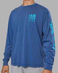 Man wearing Inferno Journey FLXCotton Oversized Long Sleeve Tee - Midnight Blue-Blue Bird | Model:Jackson | Size:L