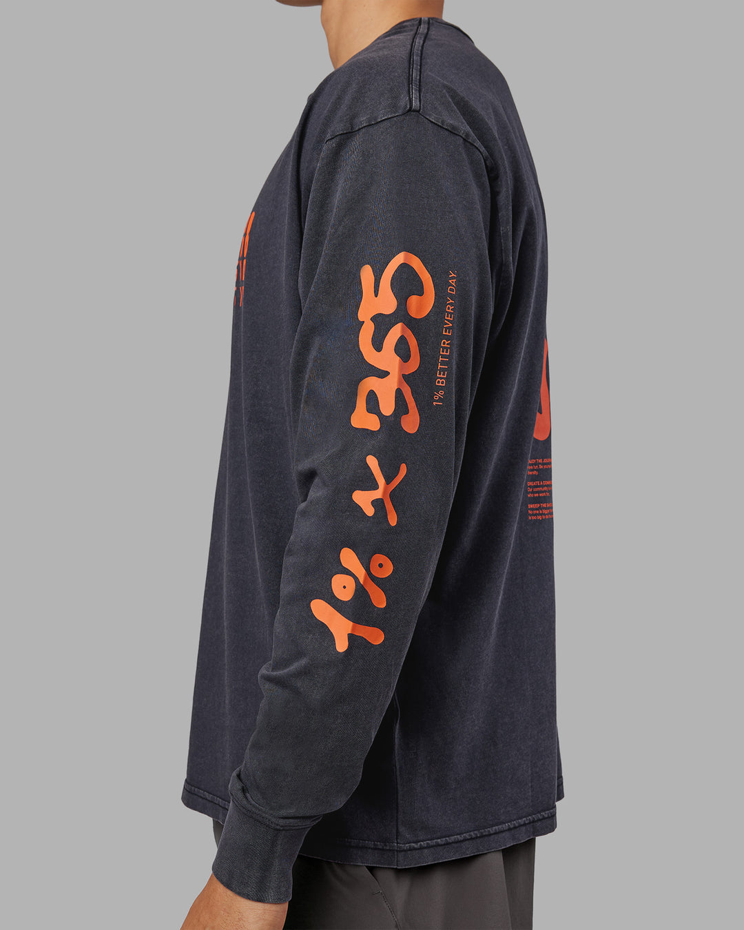 Man wearing Inferno Journey FLXCotton Oversized Long Sleeve Tee - Washed Black-Ultra Orange | Model:Jackson | Size:L