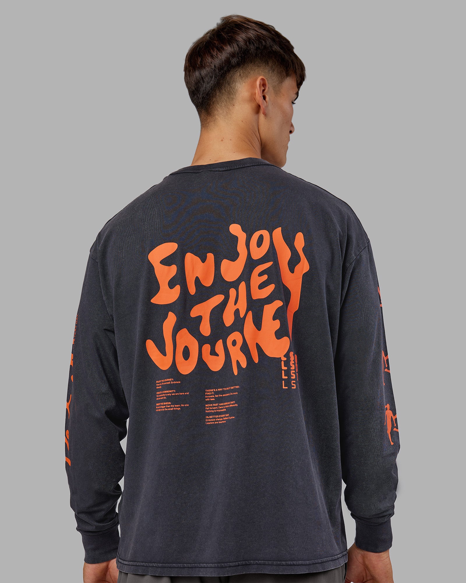 Man wearing Inferno Journey FLXCotton Oversized Long Sleeve Tee - Washed Black-Ultra Orange | Model:Jackson | Size:L