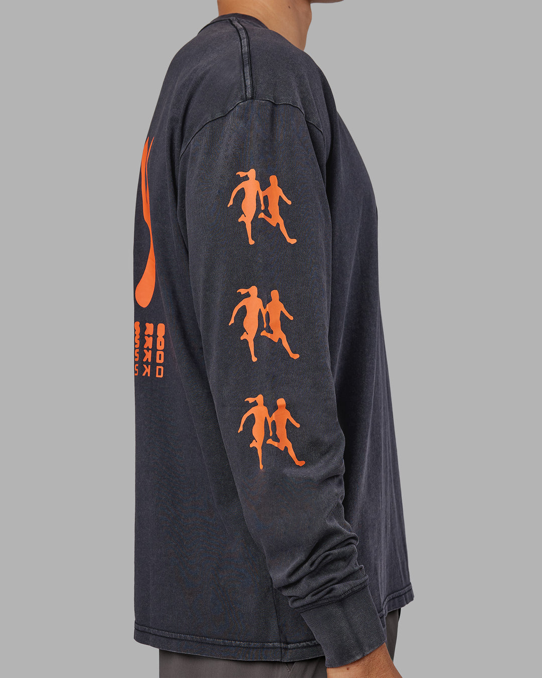 Man wearing Inferno Journey FLXCotton Oversized Long Sleeve Tee - Washed Black-Ultra Orange | Model:Jackson | Size:L