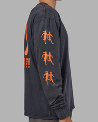 Man wearing Inferno Journey FLXCotton Oversized Long Sleeve Tee - Washed Black-Ultra Orange | Model:Jackson | Size:L