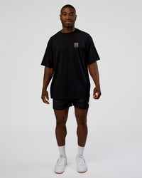 Man wearing Inferno Journey FLXCotton Oversized Tee - Black-Ultra Fuchsia | Model:Sam | Size:L