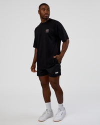 Man wearing Inferno Journey FLXCotton Oversized Tee - Black-Ultra Fuchsia | Model:Sam | Size:L