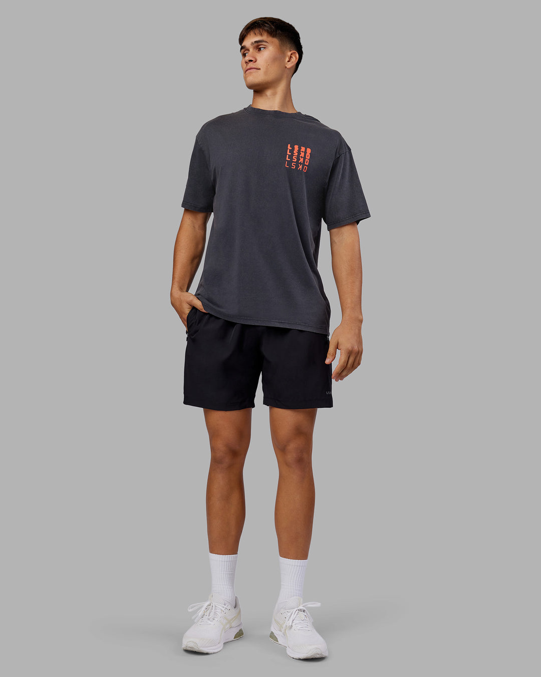 Man wearing Inferno Journey FLXCotton Oversized Tee - Black Washed-Ultra Orange | Model:Jackson | Size:L