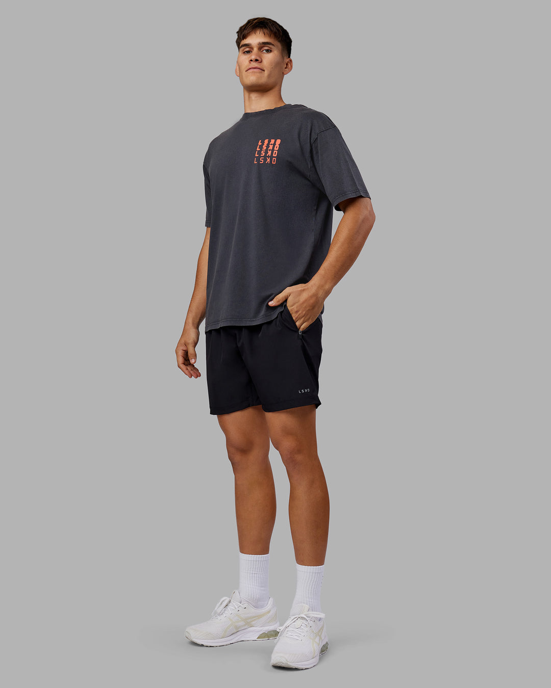 Man wearing Inferno Journey FLXCotton Oversized Tee - Black Washed-Ultra Orange | Model:Jackson | Size:L