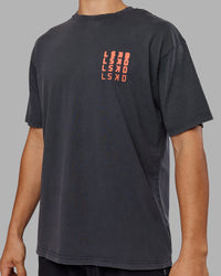 Man wearing Inferno Journey FLXCotton Oversized Tee - Black Washed-Ultra Orange | Model:Jackson | Size:L