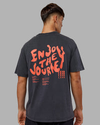 Man wearing Inferno Journey FLXCotton Oversized Tee - Black Washed-Ultra Orange | Model:Jackson | Size:L