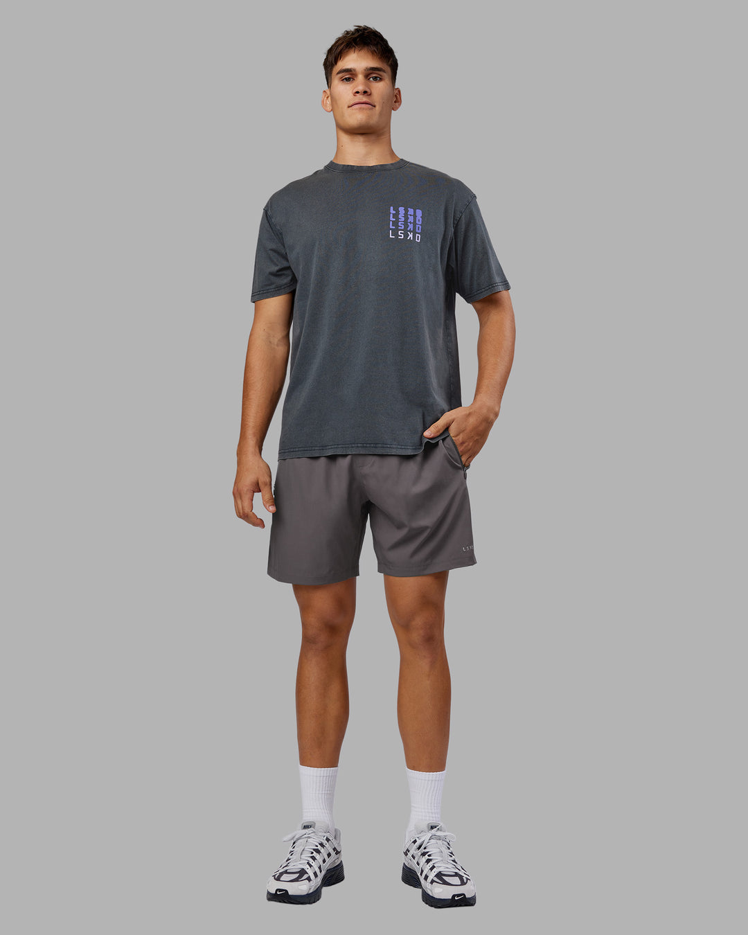 Man wearing Inferno Journey FLXCotton Oversized Tee - Black Washed-Violet Ray | Model:Jackson | Size:L