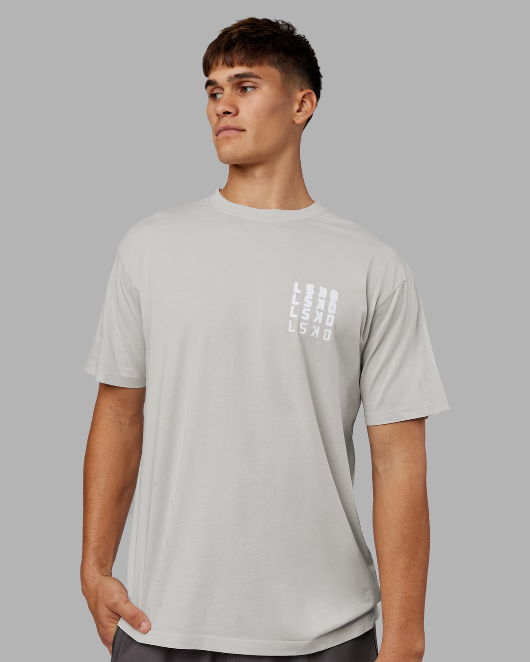 Man wearing Inferno Journey FLXCotton Oversized Tee - Digital Mist Washed-White | Model:Jackson | Size:L