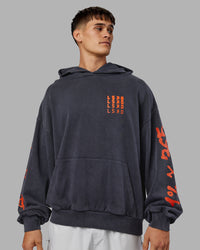 Man wearing Journey Washed Unisex Oversize Hoodie - Black-Ultra Orange | Model:Jackson | Size:L