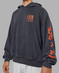 Man wearing Journey Washed Unisex Oversize Hoodie - Black-Ultra Orange | Model:Jackson | Size:L