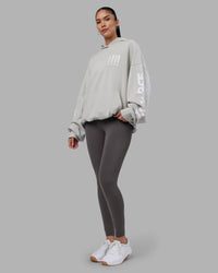 Woman wearing Journey Washed Unisex Oversize Hoodie - Digital Mist-White | Model:Rhiley | Size:L