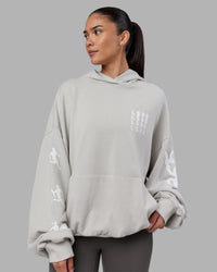 Woman wearing Journey Washed Unisex Oversize Hoodie - Digital Mist-White | Model:Rhiley | Size:L