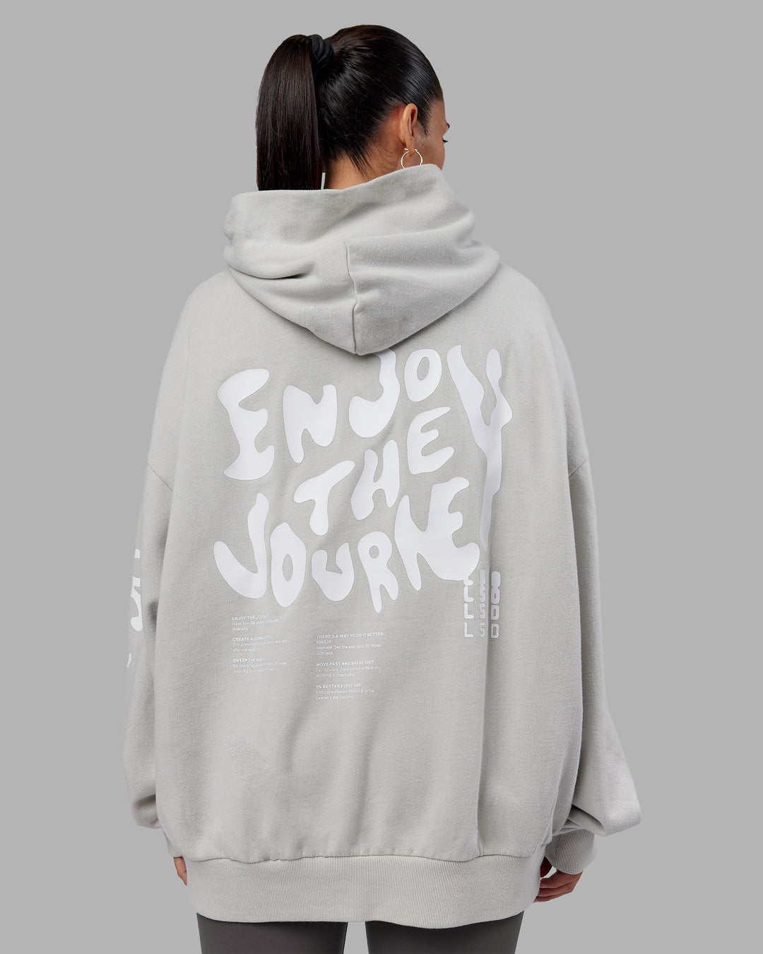 Woman wearing Journey Washed Unisex Oversize Hoodie - Digital Mist-White | Model:Rhiley | Size:L