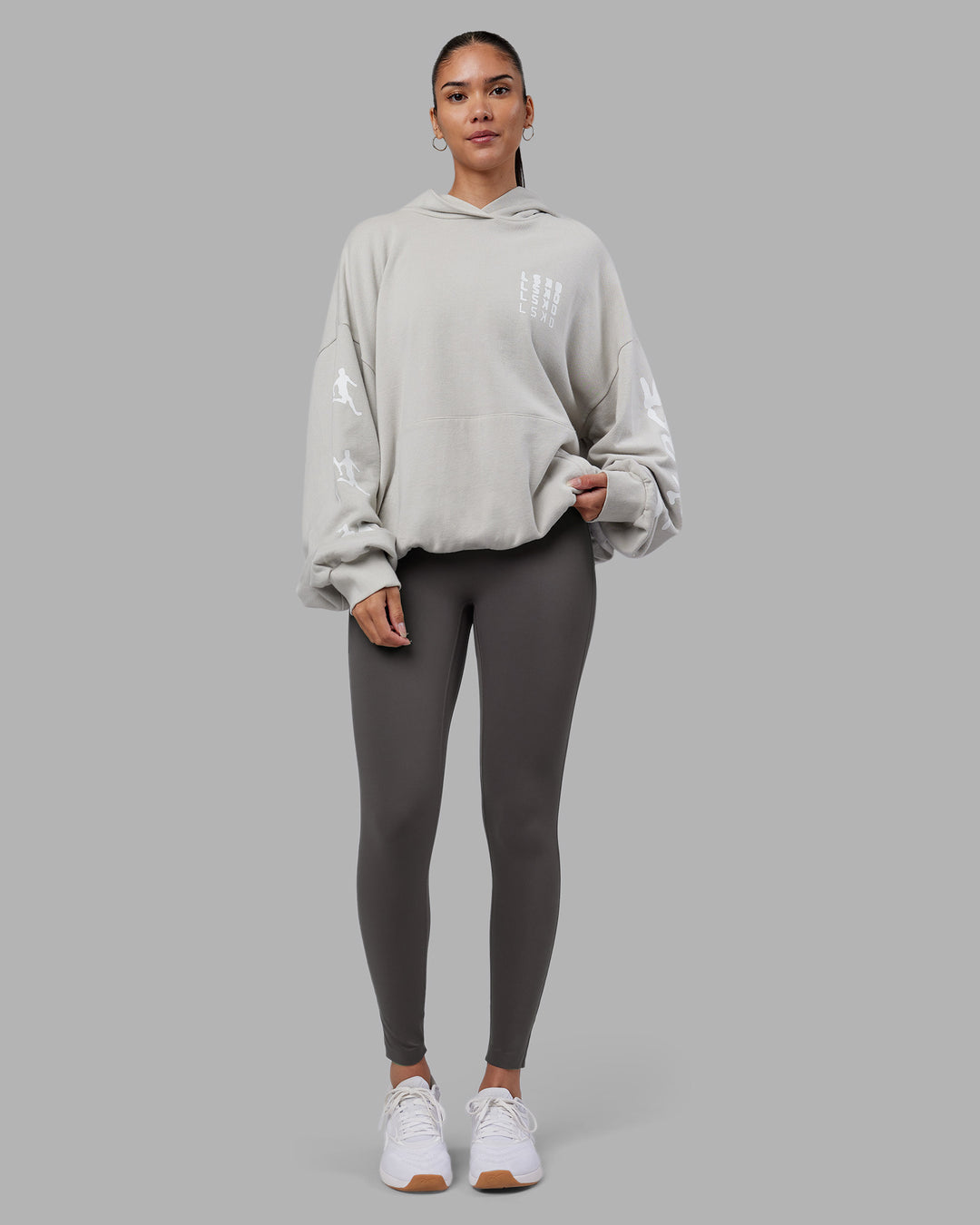 Woman wearing Journey Washed Unisex Oversize Hoodie - Digital Mist-White | Model:Rhiley | Size:L