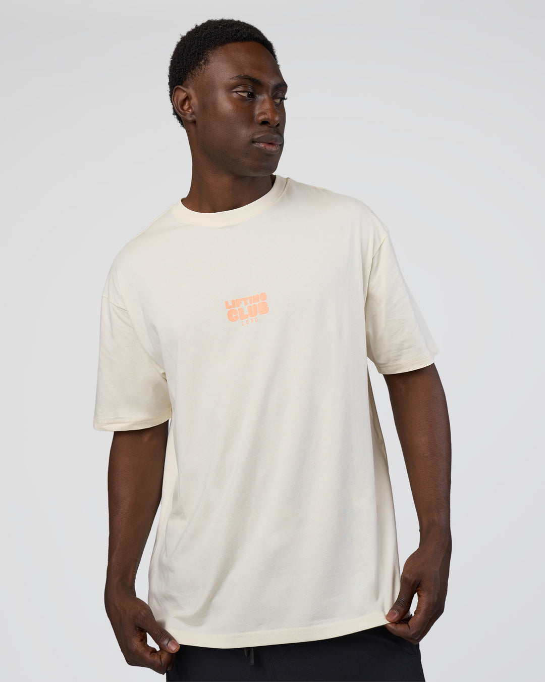 Man wearing Kettle B FLXCotton Oversized Tee - Sugar Swizzle-Cantaloupe | Model:Paabio | Size:L