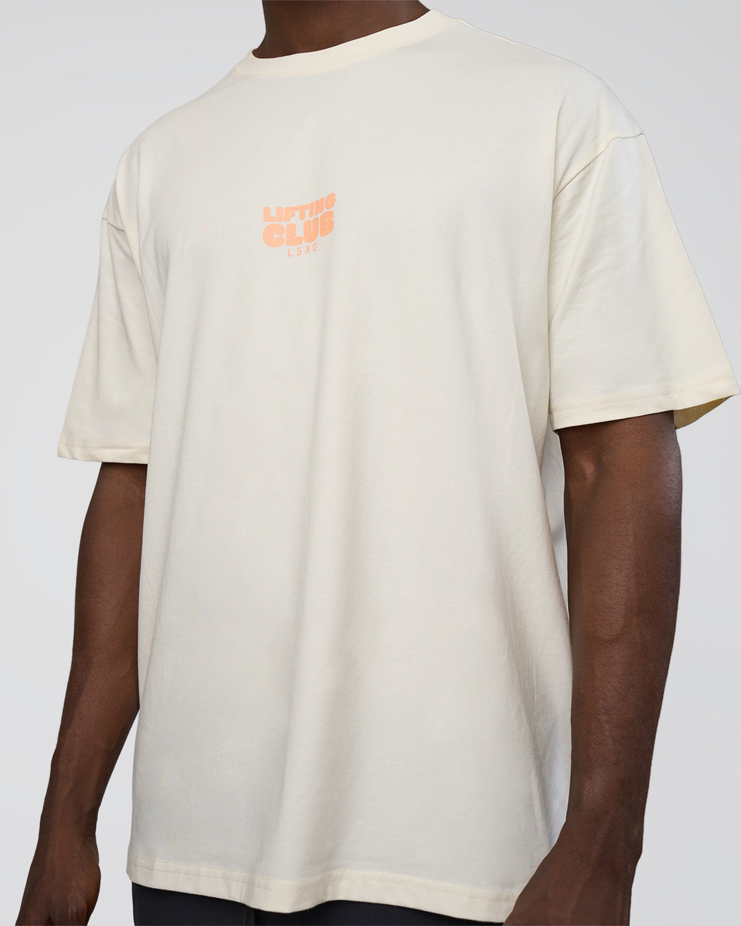 Man wearing Kettle B FLXCotton Oversized Tee - Sugar Swizzle-Cantaloupe | Model:Paabio | Size:L
