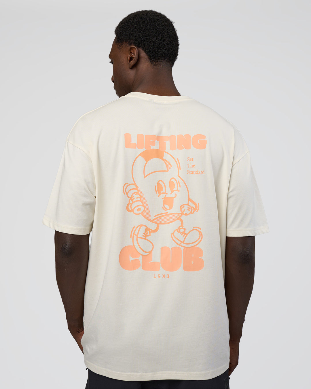 Man wearing Kettle B FLXCotton Oversized Tee - Sugar Swizzle-Cantaloupe | Model:Paabio | Size:L