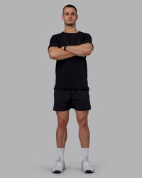 Man wearing Lift 6" Performance Shorts - Black-Reflective