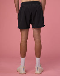 Man wearing Lift 6" Short - Black-Ultra Pink | Model:Brandon | Size:L