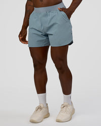 Man wearing Lift 6" Short - Dusty Blue | Model:Sam | Size:L