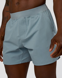 Man wearing Lift 6" Short - Dusty Blue | Model:Sam | Size:L
