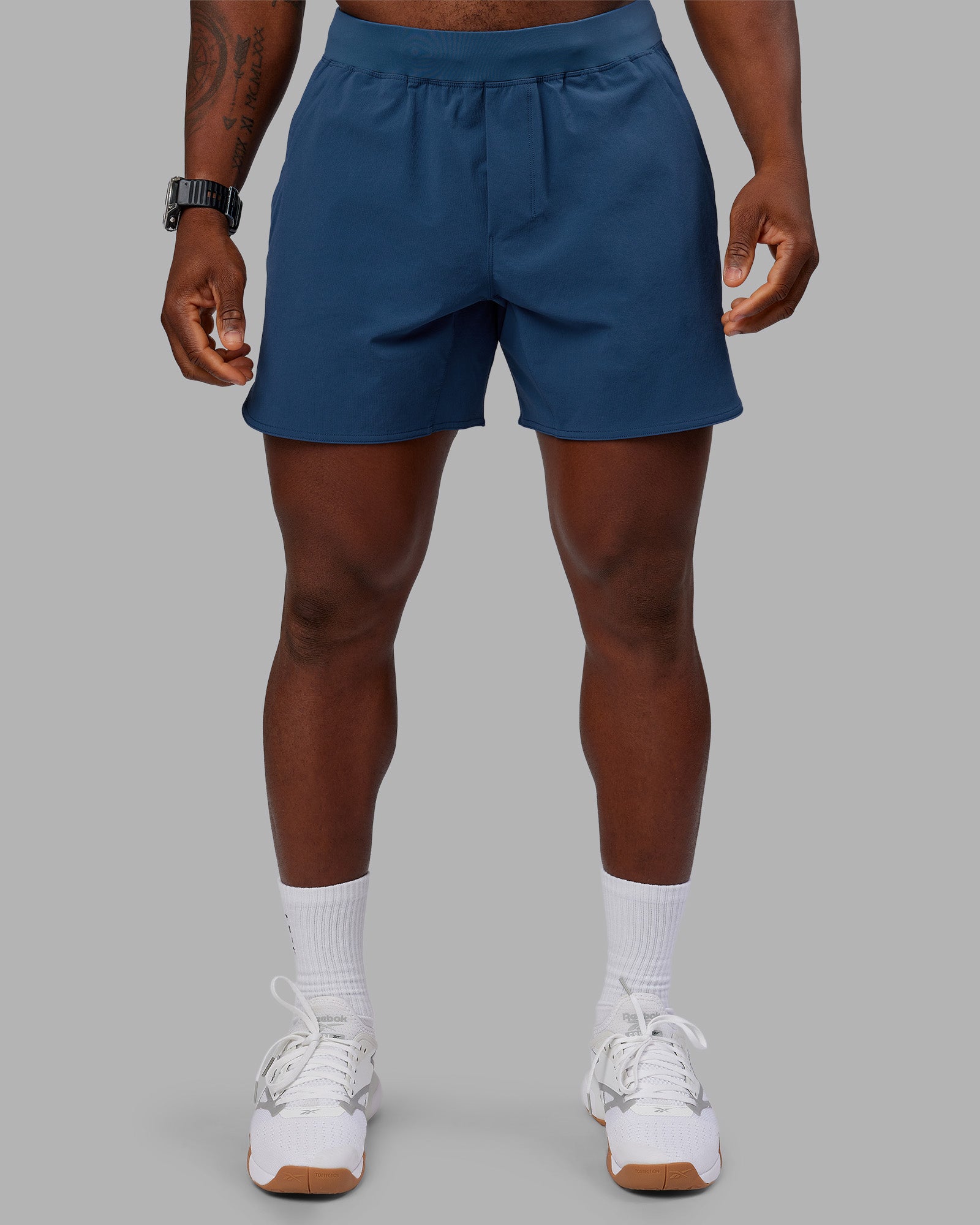 Man wearing Lift 6" Short - Indigo | Model:Sam | Size:L