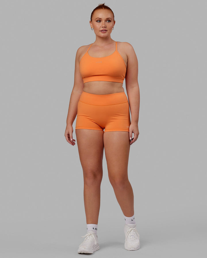 Woman wearing Lift Sports Bra - Tangerine