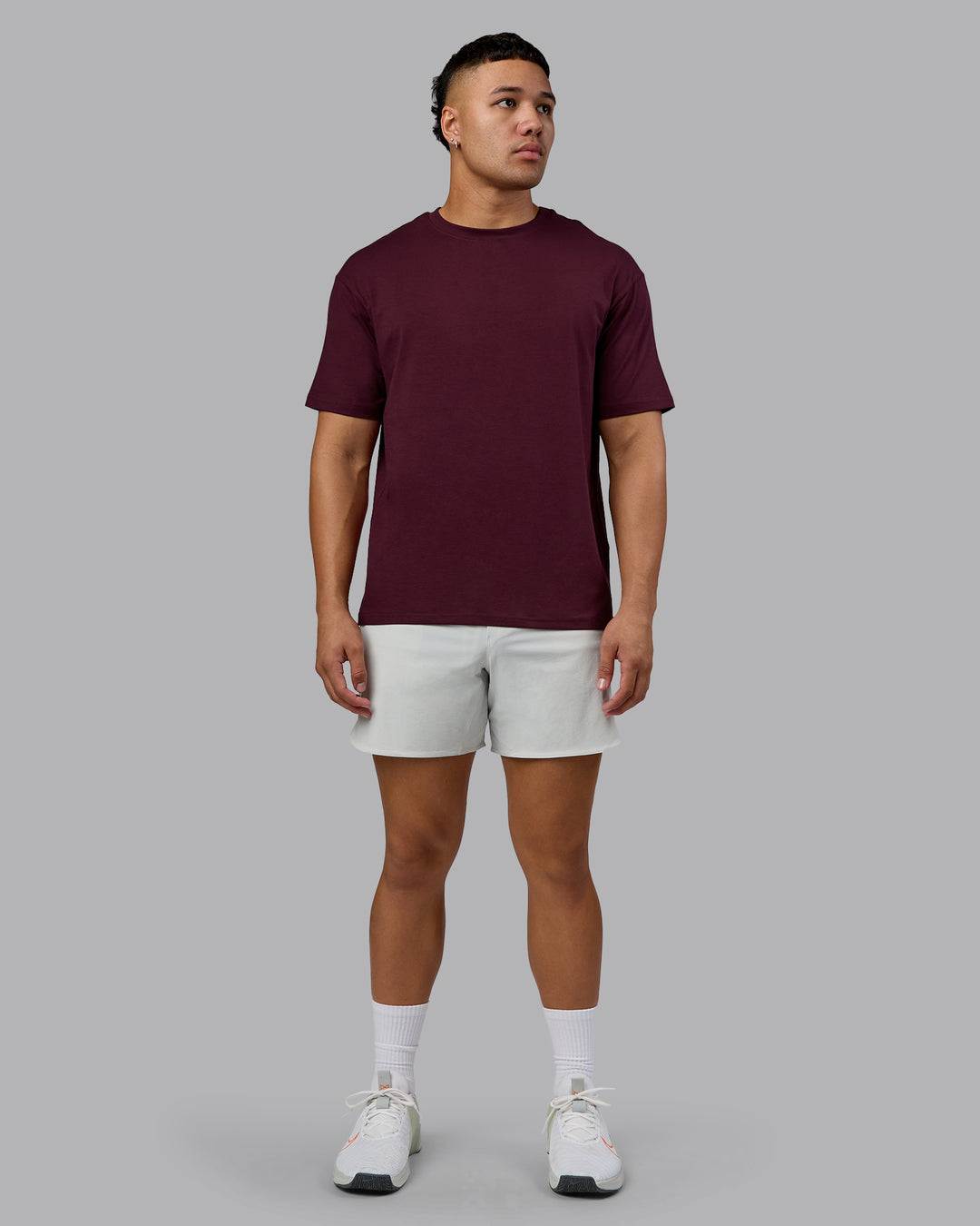Man wearing Lifting Club FLXCotton Tee Oversize - Cherry Lacquer-White | Model:Kaelyb | Size:L