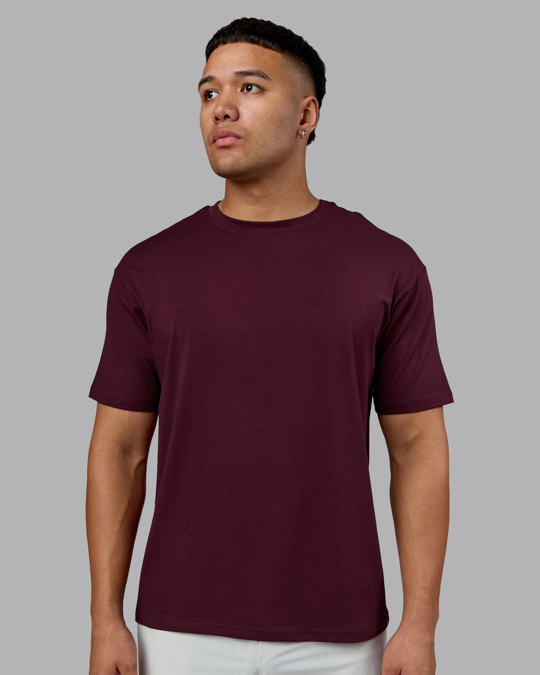 Man wearing Lifting Club FLXCotton Tee Oversize - Cherry Lacquer-White | Model:Kaelyb | Size:L