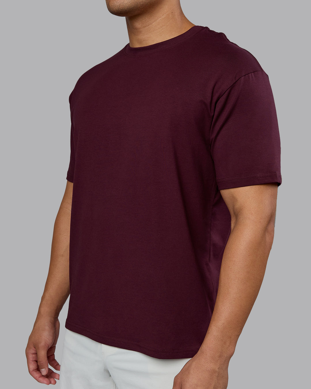 Man wearing Lifting Club FLXCotton Tee Oversize - Cherry Lacquer-White | Model:Kaelyb | Size:L
