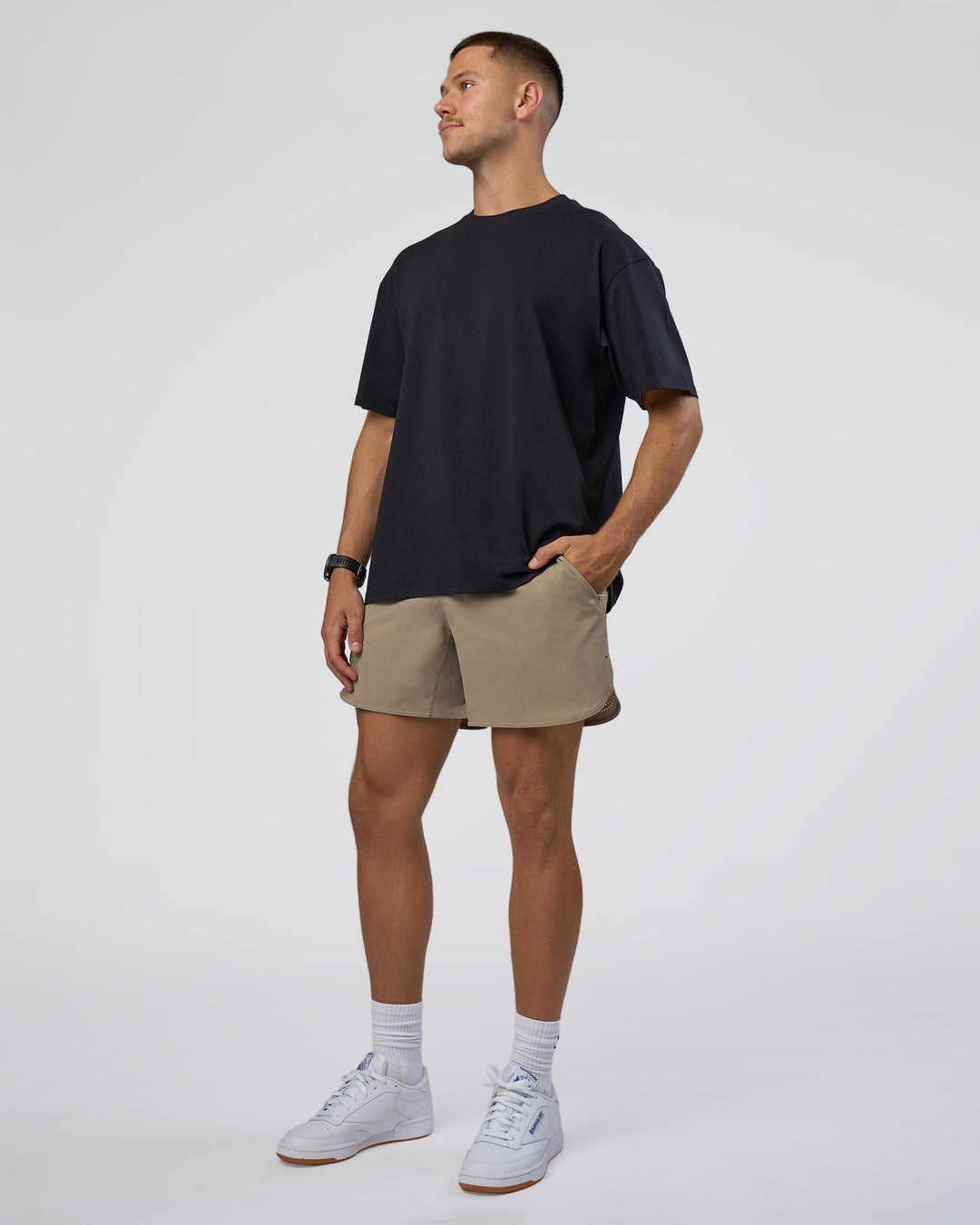 Man wearing Lifting Club FLXCotton Tee Oversize - Black-Black | Model:Nikola | Size:L