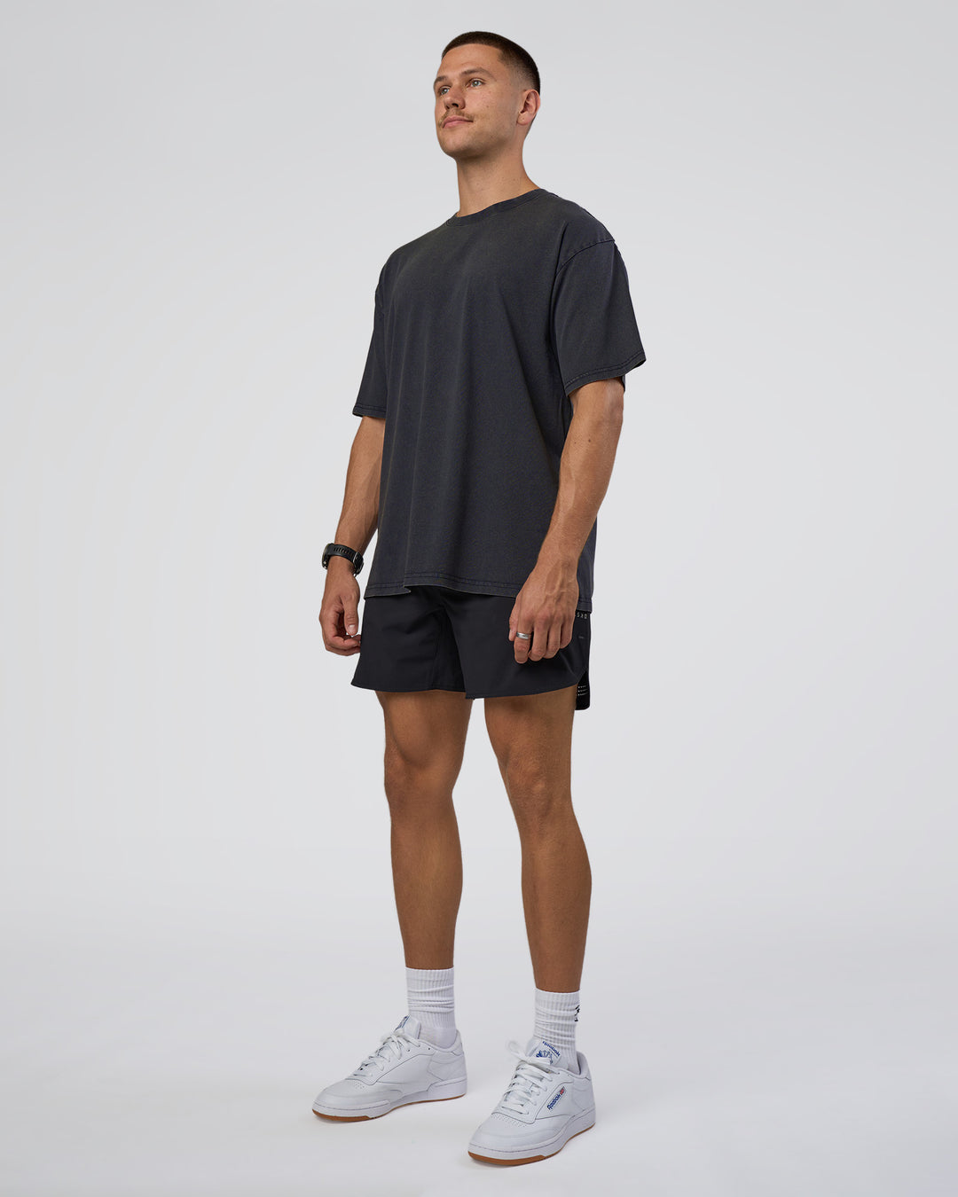 Man wearing Lifting Club FLXCotton Tee Oversize - Black Washed | Model:Nikola | Size:L