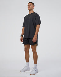 Man wearing Lifting Club FLXCotton Tee Oversize - Black Washed | Model:Nikola | Size:L