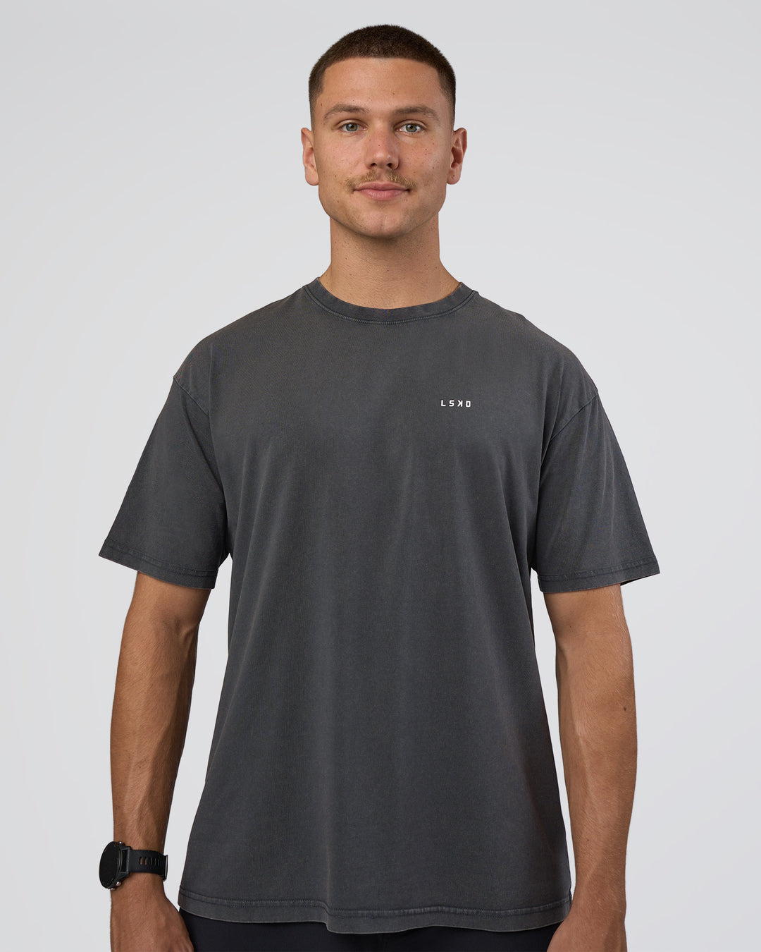 Man wearing Lifting FLXCotton Oversized Tee - Black Washed-Flame | Model:Nikola | Size:L