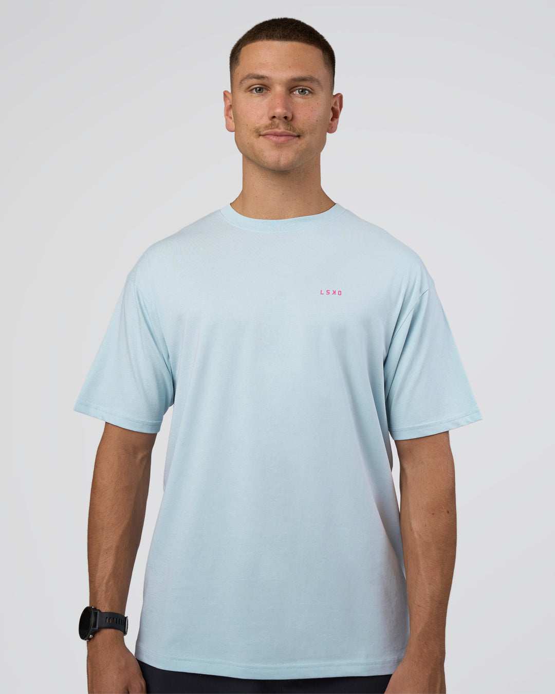 Man wearing Lifting FLXCotton Oversized Tee - Blue Aura-Ultra Pink | Model:Nikola | Size:L