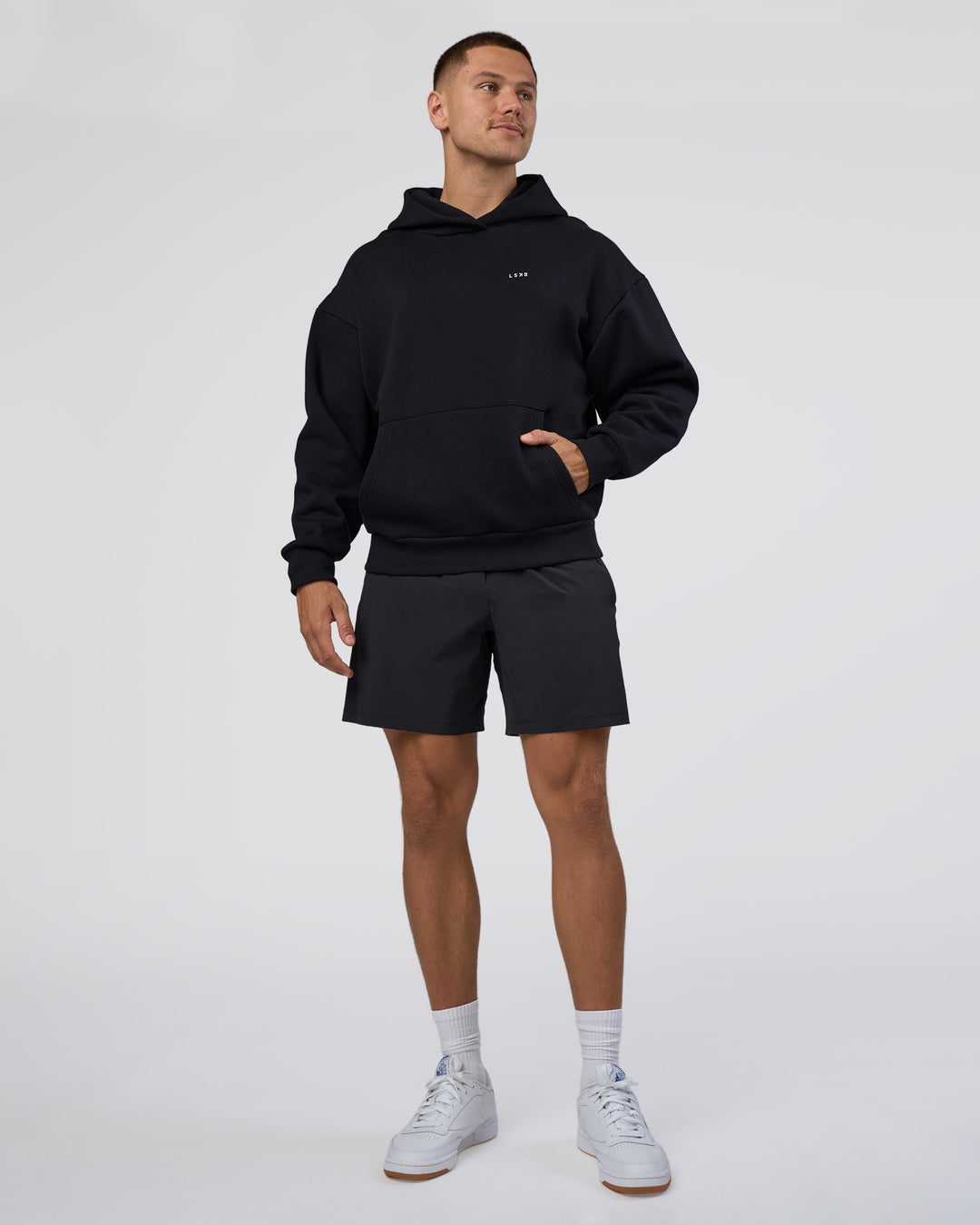 Man wearing Lifting Unisex Oversized Hoodie - Black-Flame| Model:Nikola | Size:L