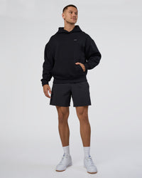 Man wearing Lifting Unisex Oversized Hoodie - Black-Flame| Model:Nikola | Size:L