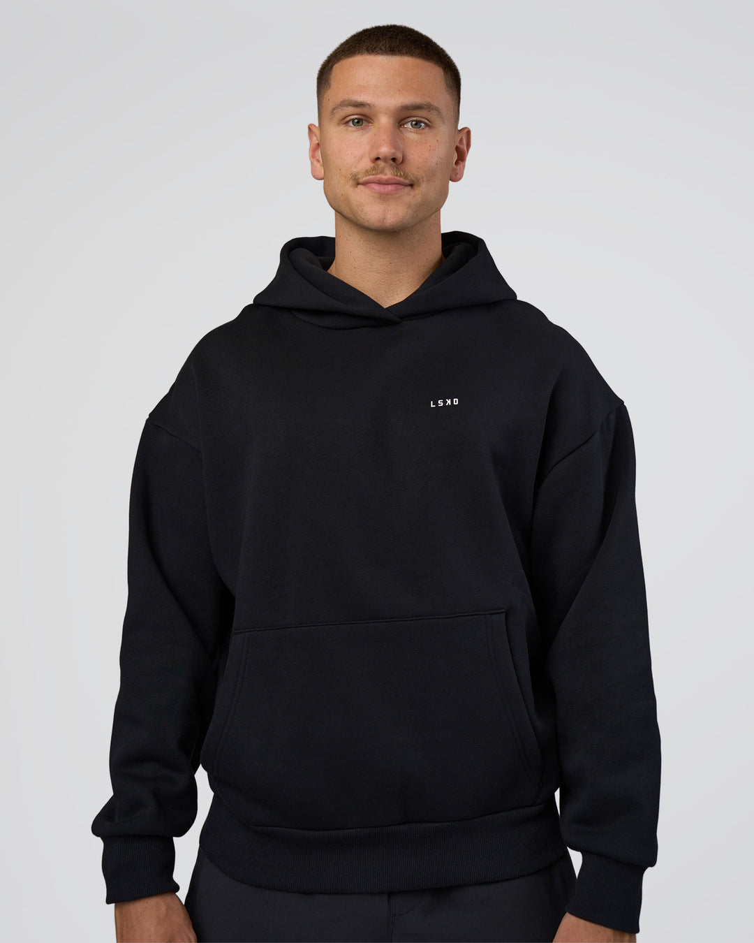 Man wearing Lifting Unisex Oversized Hoodie - Black-Flame| Model:Nikola | Size:L
