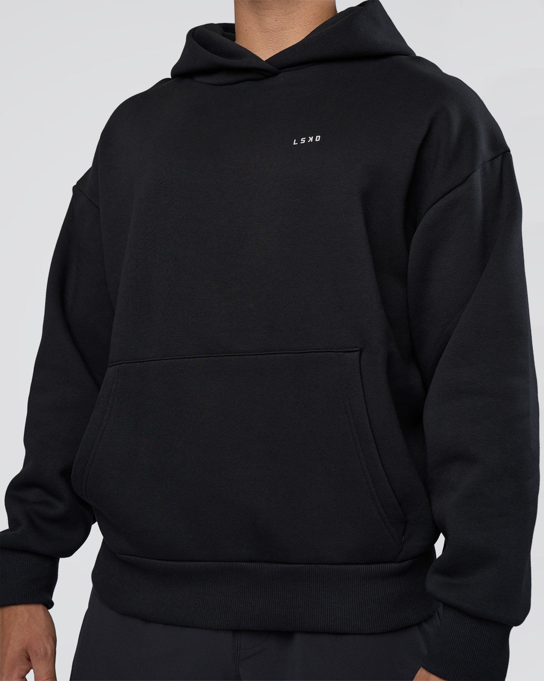 Man wearing Lifting Unisex Oversized Hoodie - Black-Flame| Model:Nikola | Size:L