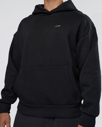 Man wearing Lifting Unisex Oversized Hoodie - Black-Flame| Model:Nikola | Size:L