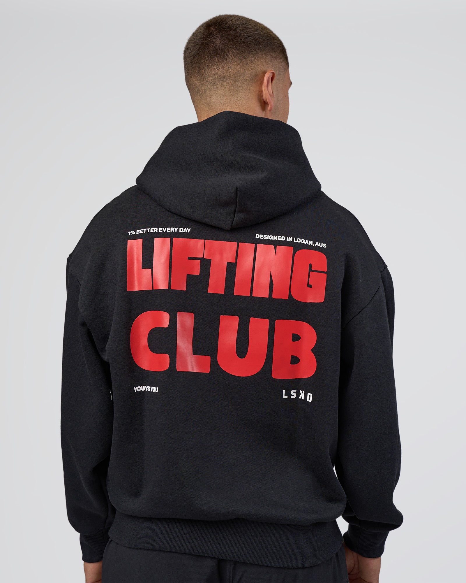 Man wearing Lifting Unisex Oversized Hoodie - Black-Flame| Model:Nikola | Size:L