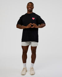 Man wearing Love the Journey FLXCotton Oversized Tee - Black-Flame | Model:Sam | Size:L