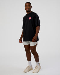 Man wearing Love the Journey FLXCotton Oversized Tee - Black-Flame | Model:Sam | Size:L