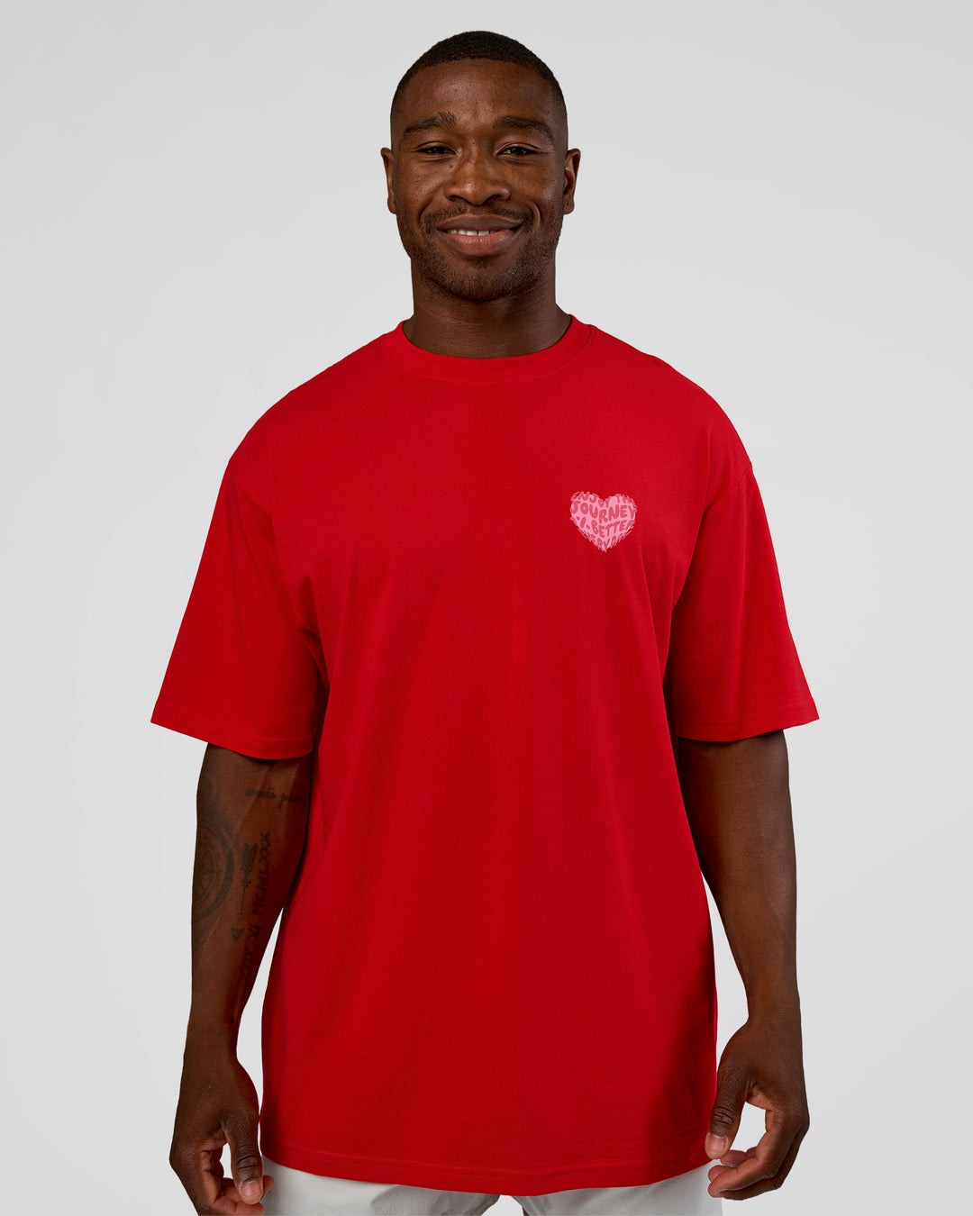 Man wearing Love the Journey FLXCotton Oversized Tee - Flame-Candy Pink | Model:Sam | Size:L