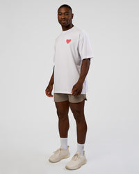 Man wearing Love the Journey FLXCotton Oversized Tee - White-Candy Pink | Model:Sam | Size:L